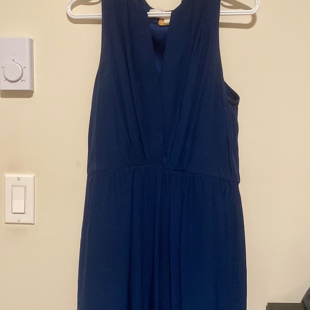 Used boutique dress needs a little love, has a small burn hole at bottom